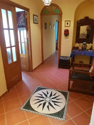 a hallway with a door and a tile floor at La casa del mar by Gades Gestión in Cádiz