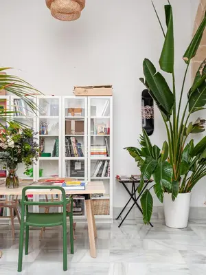 a room with a table and a potted plant at Art Suites by Casa de Indias in El Puerto de Santa María