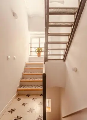 a staircase in a building with a stair case at Feel the Sherry experience2 by Musgo in Jerez de la Frontera