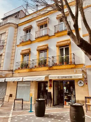 a building with windows and balconies on a street at Feel the Sherry experience2 by Musgo in Jerez de la Frontera