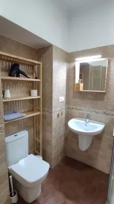 a bathroom with a toilet and a sink at Dormir en Cádiz in Cádiz