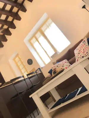 a living room with a couch and a window at Twins' Home Chancillería, Jerez Centro, Cádiz, wifi in Jerez de la Frontera