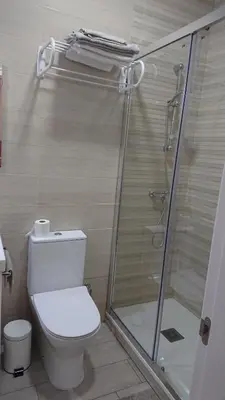 a bathroom with a toilet and a shower at La Caleta - La Viña in Cádiz