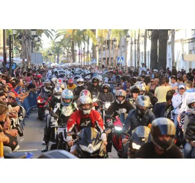 a large group of people riding motorcycles down a street at APARTAMENTO Centro ciudad in Jerez de la Frontera