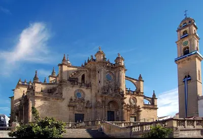 a large building with a clock tower and stairs at APARTAMENTO Centro ciudad in Jerez de la Frontera