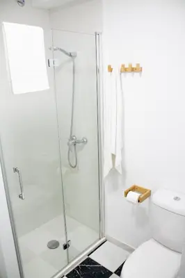 a shower stall in a bathroom with a toilet at Apartamento Argantonio by Cadiz Time in Cádiz