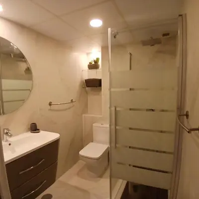 a bathroom with a shower and a toilet and a sink at ***** ATTIC WITH IMPRESSIVE VIEWS AND JACUZZI in Cádiz