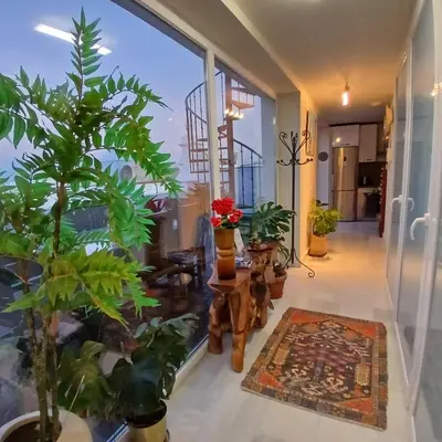 a living room with plants and a staircase at ***** ATTIC WITH IMPRESSIVE VIEWS AND JACUZZI in Cádiz