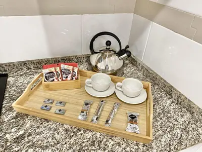 a wooden tray with a tea set on a counter at San Francisco 15 in Cádiz