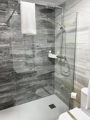 a bathroom with a shower and a toilet at San Francisco 15 in Cádiz