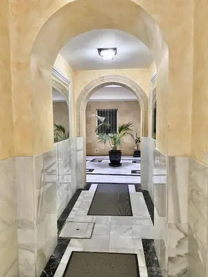 a hallway with an archway in a building at San Francisco 15 in Cádiz