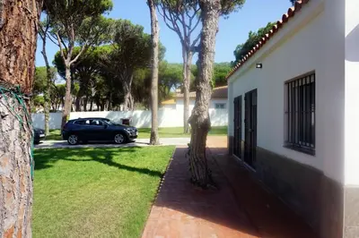 a car parked in the driveway of a house at Relax y playa en la Barrosa in Chiclana de la Frontera