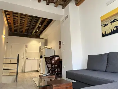 a living room with a couch and a table at El Chicuco en el corazón de Cádiz Grupo AC Gestion in Cádiz