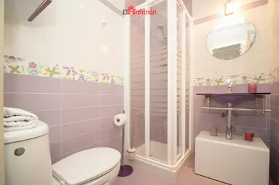 a bathroom with a toilet and a shower at ATICO NUEVO en el BARRIO ALTO SANLÚCAR in Sanlúcar de Barrameda