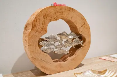 a wooden bowl with a pile of silver metals at ATICO NUEVO en el BARRIO ALTO SANLÚCAR in Sanlúcar de Barrameda