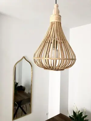 a hanging lamp and a mirror in a room at Almijar 9 in Sanlúcar de Barrameda