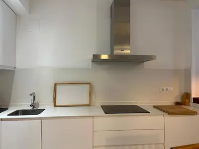 a kitchen with white cabinets and a sink at El Bastinazo con Terraza Privada Grupo AC Gestion in Cádiz