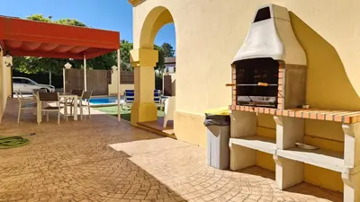 a pizza oven on the side of a house at Casa de la Jara 10 in Sanlúcar de Barrameda