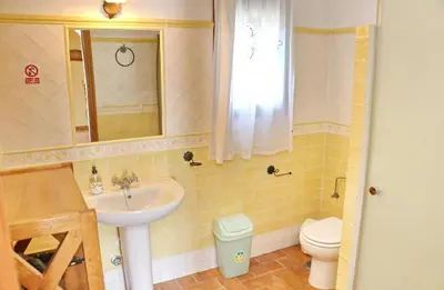 a bathroom with a sink and a toilet at Chalet de la casa Forestal in Conil de la Frontera