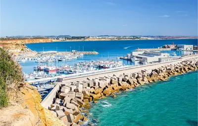 a marina with boats in the water and a dock at Nice Home In Conil De La Frontera in Conil de la Frontera