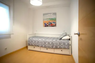 a small bedroom with a bed in a room at Santo Tomás B Ha Apartment in Cádiz