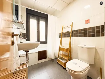 a bathroom with a toilet and a sink at URBAN BEACH Grupo AC Gestion in Cádiz