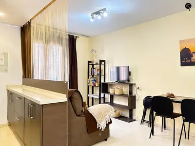 a living room with a kitchen and a dining room at URBAN BEACH Grupo AC Gestion in Cádiz