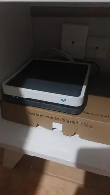 a box with a cell phone sitting on top of it at Apto Playa de Regla, primera linea, Parking, AA y wifi in Chipiona