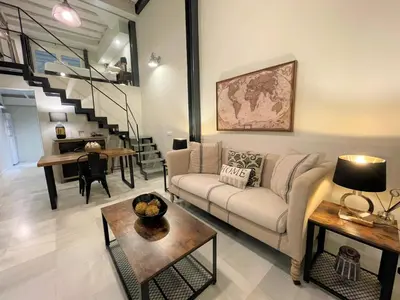 a living room with a couch and a table at No 38 Cádiz in Cádiz