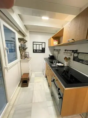 a kitchen with a stove and a counter top at No 38 Cádiz in Cádiz
