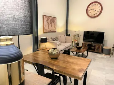 a living room with a couch and a table at No 38 Cádiz in Cádiz