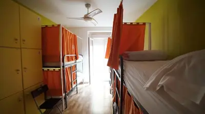 a bedroom with two bunk beds and a ceiling fan at Summer Cádiz in Cádiz