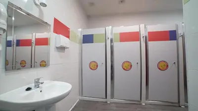 a bathroom with a sink and four shower stalls at Summer Cádiz in Cádiz