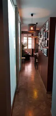a hallway with a living room and a dining room at LA CASA DE HERACLES CADIZ in Cádiz