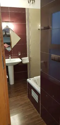a bathroom with a sink and a mirror at LA CASA DE HERACLES CADIZ in Cádiz