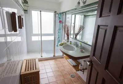 a bathroom with a sink and a large mirror at Chalet Villa Ventolera Novo Sancti Petri Chiclana in Chiclana de la Frontera
