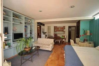 a living room with a couch and a table at Chalet Villa Ventolera Novo Sancti Petri Chiclana in Chiclana de la Frontera
