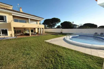 a house with a swimming pool in the yard at Chalet Villa Ventolera Novo Sancti Petri Chiclana in Chiclana de la Frontera