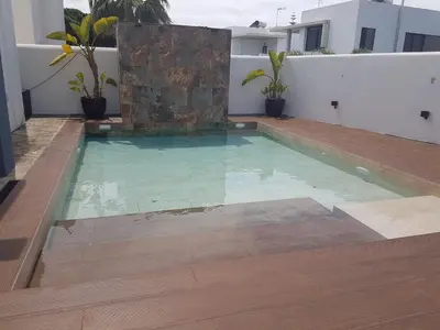 a swimming pool on the roof of a house at Villa chillout la barrosa in Chiclana de la Frontera