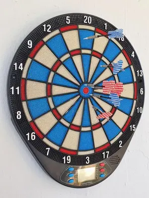 a dartboard clock with a dart board on it at Casa Rural El Pinar de Jesus in Arcos de la Frontera
