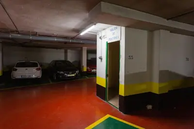 a parking garage with two cars parked in it at GAVIOTA Family Home free parking by Cadiz4Rentals in Cádiz