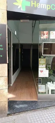 a store front window of a store with a wooden floor at Diana de Columela by Cadiz Time in Cádiz