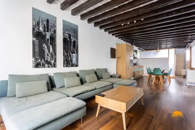 a living room with a couch and a table at Diana de Columela by Cadiz Time in Cádiz