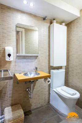 a bathroom with a toilet and a sink at Casa Isabela by Cadiz Time in Cádiz