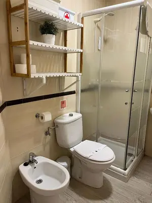 a bathroom with a toilet and a sink and a shower at Rinconcito del Falla Grupo AC Gestion in Cádiz
