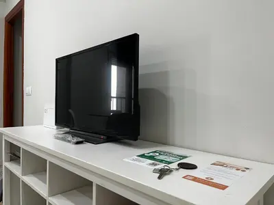 a flat screen tv sitting on top of a table at Las Gemelas de Benjumeda en la Caleta Grupo AC Gestion in Cádiz