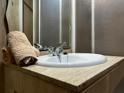 a bathroom sink with a towel on top of it at Las Gemelas de Benjumeda en la Caleta Grupo AC Gestion in Cádiz