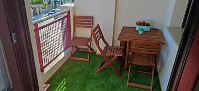 a balcony with a table and two chairs and a table and a table and chairs at VALDECARRETAS Apartamento Rota cerca de playa in Rota