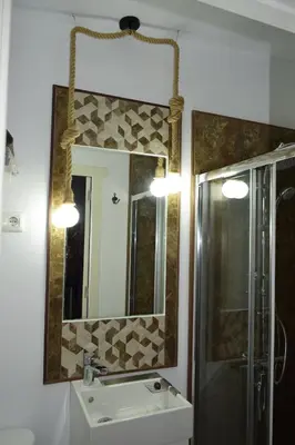 a bathroom with a sink and a mirror at LOS TOCHOS in Chiclana de la Frontera