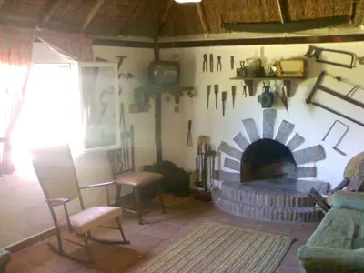 a living room with a fireplace and a couch at Bright House in Sanlúcar – Fireplace in Sanlúcar de Barrameda